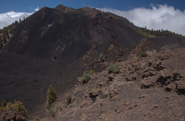 La Palma, long-range popular hiking route Ruta de Los Volcanes, landscapes around 
black crater of El Duraznero volcano, formed in 1949