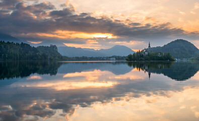 Fototapeta na wymiar Lake Bled on a fierce and vivid sunrise