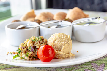 Traditional middle eastern homemade dishes falafel, pita, hummus and chickpea served with...