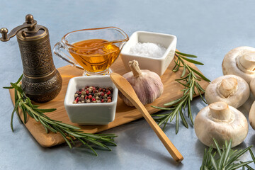 Ingredients for pork roasting: spices, herbs, agaricus, oil