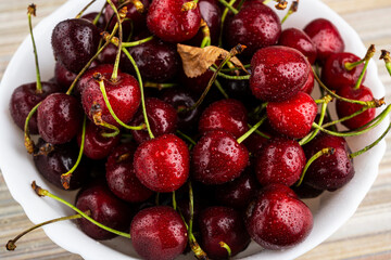 Fresh and ripe cherries in a bowl. cherries in a bowl with water drops