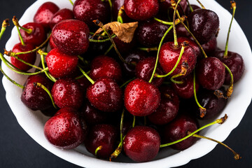 Fresh and ripe cherries in a bowl. cherries in a bowl with water drops
