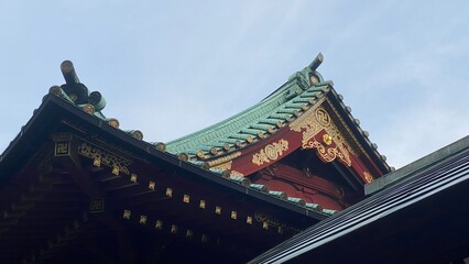 Fototapeta na wymiar The early morning sunlight and the Japanese architectural rooftop shine on a summery season, the Kamon, family crest, Hafuita, Oniita, Gegyo, Omune and all the grateful traditional designs. 2022/6/18