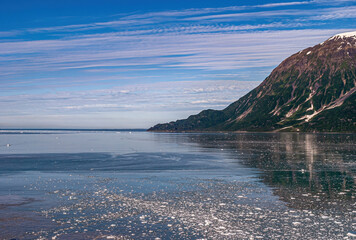 Disenchantment Bay, Alaska, USA - July 21, 2011: Looking out towards ocean under blue cloudscape,...