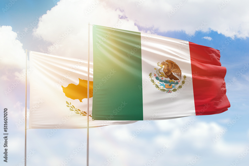 Wall mural sunny blue sky and flags of mexico and cyprus