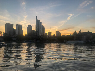 Obraz premium Frankfurt, Germany - May, 2022: city skyline - Sunset in River Main