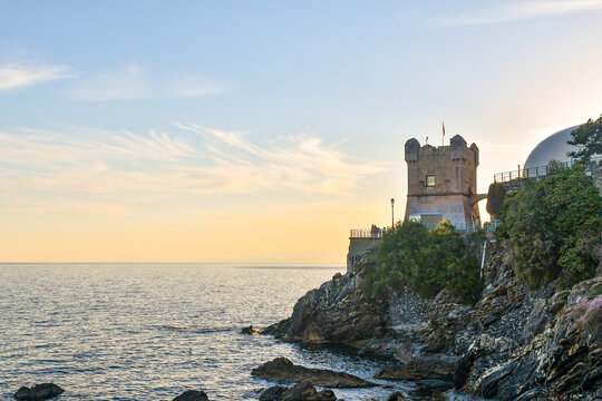 Torre Groppallo, a defensive construction against attacks by Turkish pirates of Dragut (16th century), on the Anita Garibaldi Promenade at sunset, Nervi, Genoa, Liguria,	