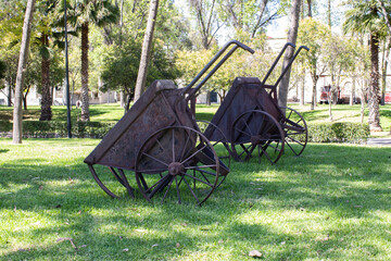 old metal wheelbarrow in a train railway museum, museo del ferrocarril, Puebla, Mexico
