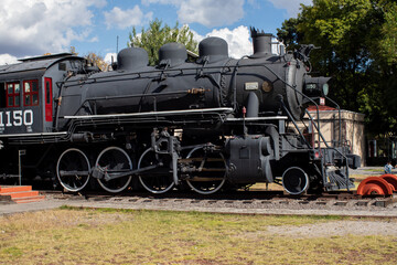 Naklejka premium black old mexican train locomotive in museo del ferrocarril, Puebla, railway museum, Mexico