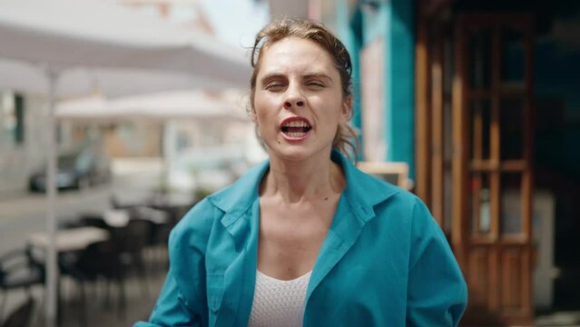 Young woman angry screaming at street
