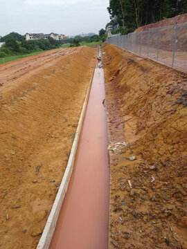 Temporary sediment and sludge filters installed at construction sites. All water from the nearest construction site is drained here and filtered before being discharged into a normal drain.
