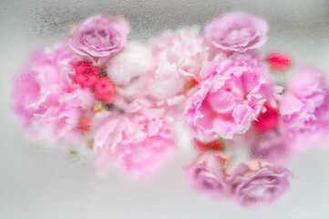 Abstract flower bouquet background under water drops