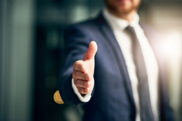 Welcome to a new opportunity. Cropped shot of an unrecognizable businessman extending a handshake...
