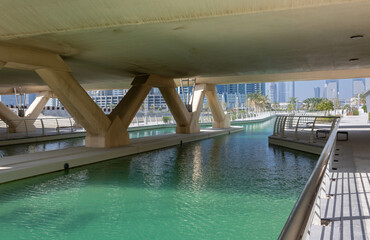 Fototapeta na wymiar Al Reem Central park with seawater canals under bridge and crossing in Abu Dhabi