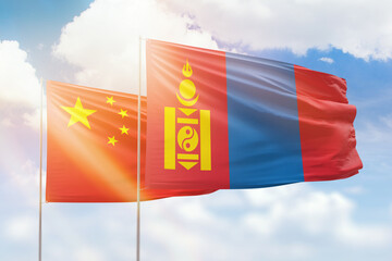 Sunny blue sky and flags of mongolia and china
