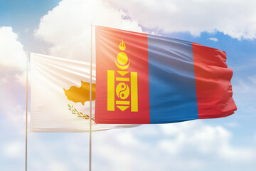 Sunny blue sky and flags of mongolia and cyprus