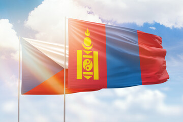 Sunny blue sky and flags of mongolia and czechia