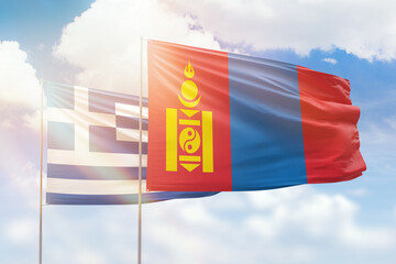 Sunny blue sky and flags of mongolia and greece