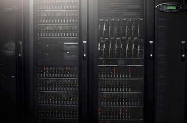 Neat and organized for an efficient computer network. Cropped shot of industrial computers in the...
