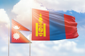 Sunny blue sky and flags of mongolia and nepal