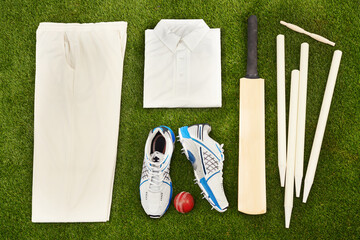 Ready to hit the pitch. High angle shot of cricket gear.