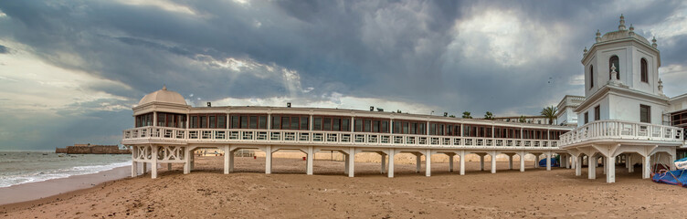Panoramic view of the Bathhouse of La Caleta, a beautiful building on the beach of Cadiz, Andalusia, Spain