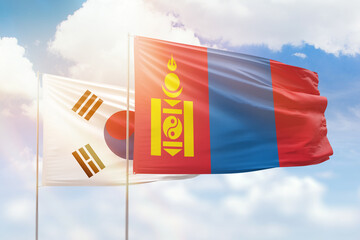 Sunny blue sky and flags of mongolia and south korea