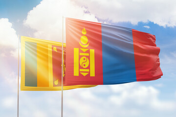 Sunny blue sky and flags of mongolia and sri lanka