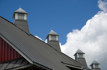 Aluminum Red Barn Roof with Ventilation and Blue Sky