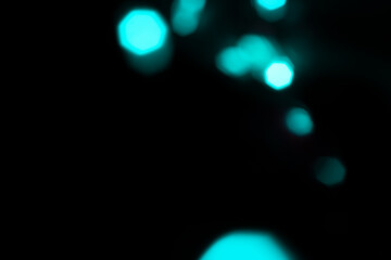 Vintage lights background. turquoise lights and blue glitter. defocused