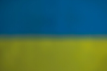 Close up texture view in defocus of abstract design of flag of Ukraine.