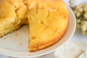 Moist and delicious homemade pineapple cake. White background, top view.