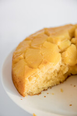 Moist and delicious homemade pineapple cake. White background, top view.