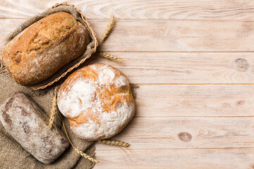 Freshly baked bread on basket against natural background. top view bread copy space