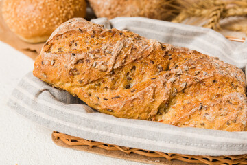 Homemade natural breads. Different kinds of fresh bread as background, perspective view with copy space