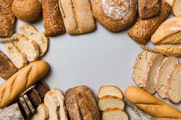 Homemade natural breads. Different kinds of fresh bread as background, top view with copy space