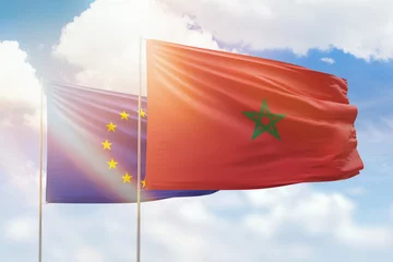 Zelfklevend Fotobehang Sunny blue sky and flags of morocco and european union © prehistorik