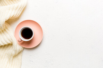 Flat lay composition with colorful Autumn cup of coffee and leaves on a color background. top view