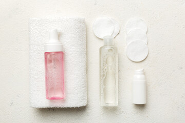 Micellar cleansing water and discs to remove cosmetics and cleanse the skin on colored background. Copy space top view