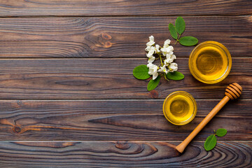 honey jar with acacia flowers and leaves. fresh honey top view flat lay