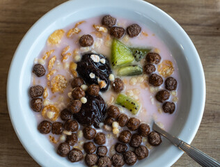 a bowl with cereals and fruits