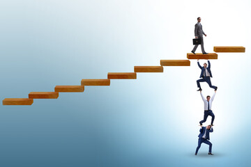 Fototapeta premium Teamwork concept with businessmen helping each other