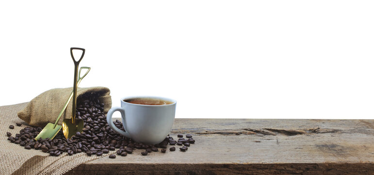 Coffee cup with coffee beans roating on the wooden table