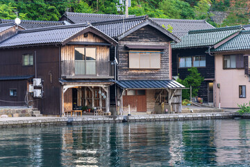 Fototapeta na wymiar Lined up boathouses at Ine Town in Kyoto, Japan