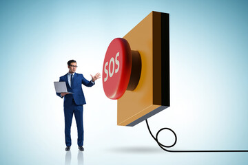 Businessman pressing SOS button in case of danger