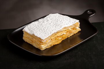 Mille feuille dessert on the plate.