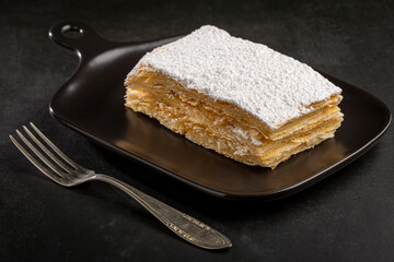 Mille feuille dessert on the plate.