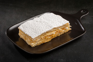 Mille feuille dessert on the plate.