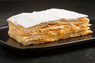 Mille feuille dessert on the plate.