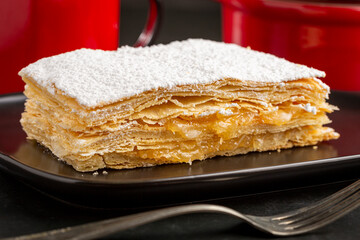 Mille feuille dessert on the plate.